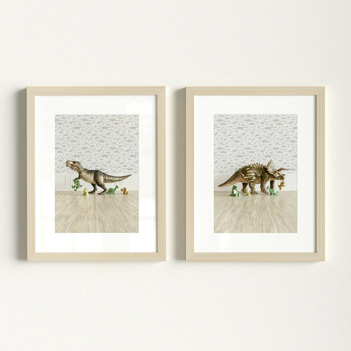 Two framed prints of toy dinosaurs on a wooden floor with a light gray wall background. | The Crown Prints